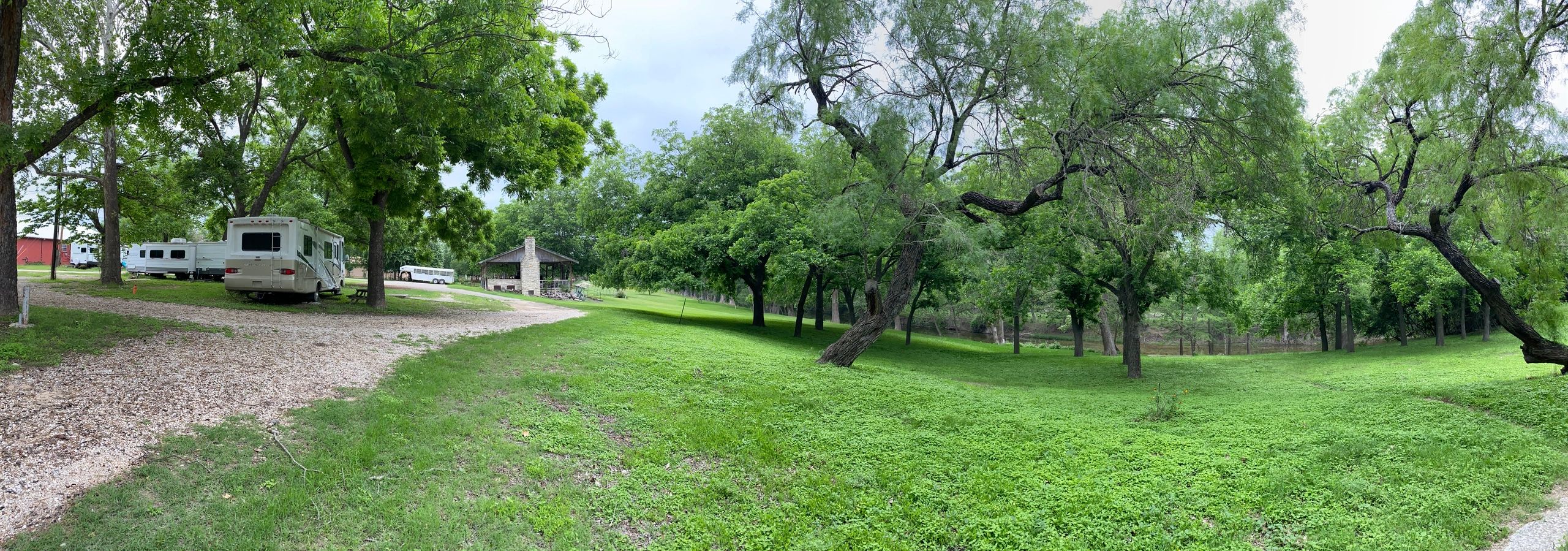 Panoramic view of RV park, pavilion, meadow and river